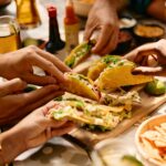 friends-eating-tacos-in-Mexican-restaurant