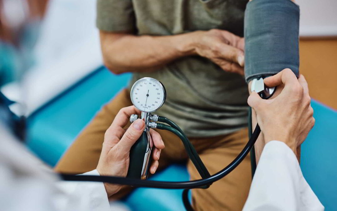 family doctor checking blood pressure