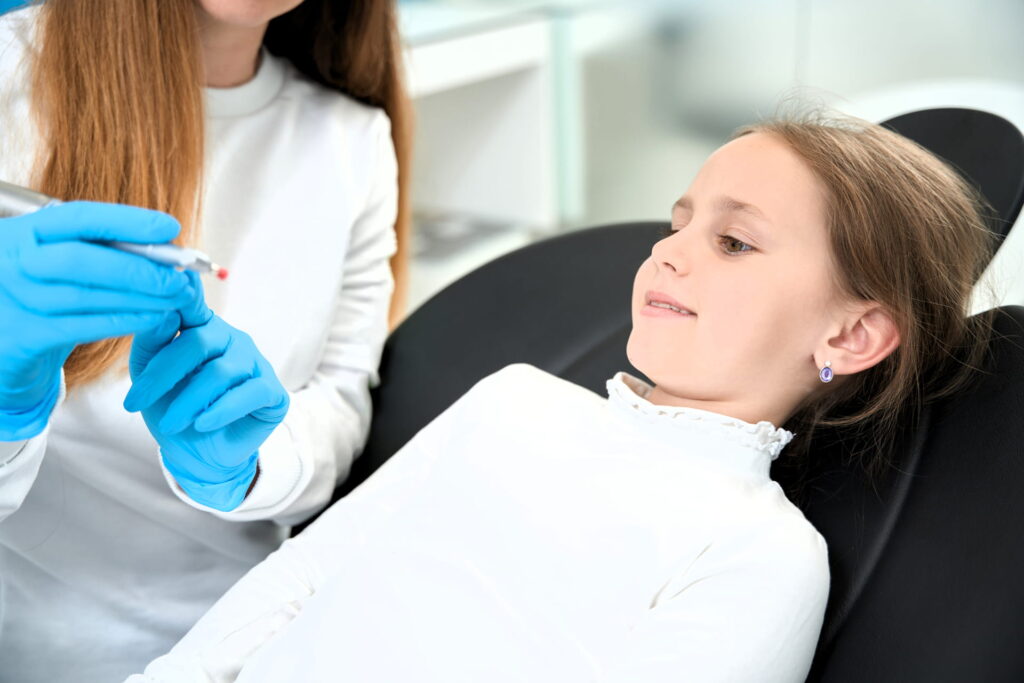 pediatric dentist with a patient