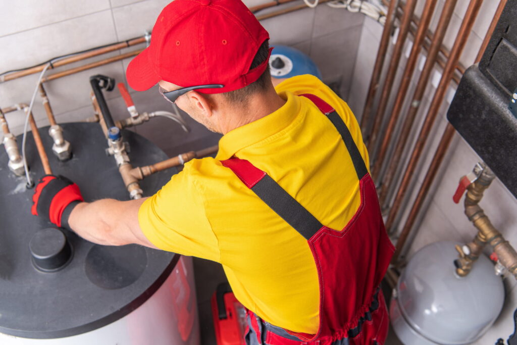 plumber-fixing-water-heating-system