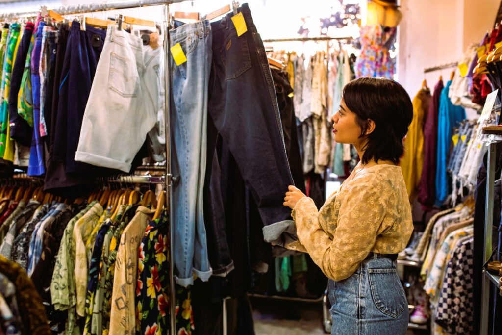 young-woman-looking-for-clothes-on-rack