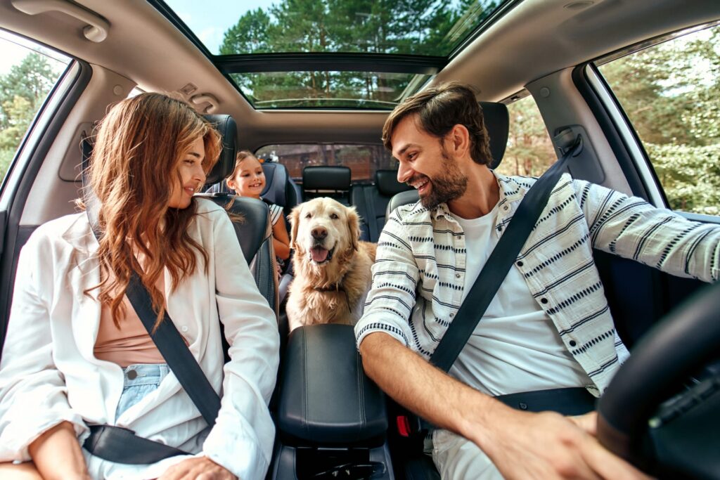 Your Trusted Car Insurance Agency family in a car