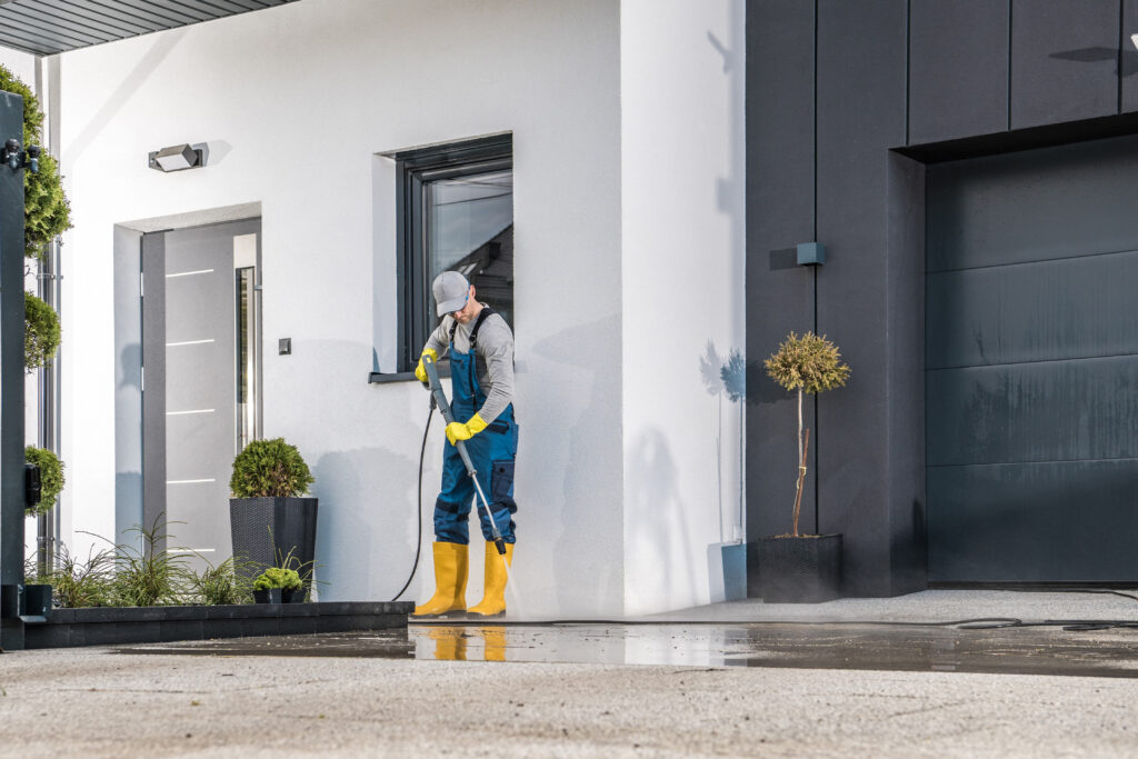 Professional Pressure Washing a driveway