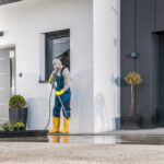 Professional Pressure Washing a driveway