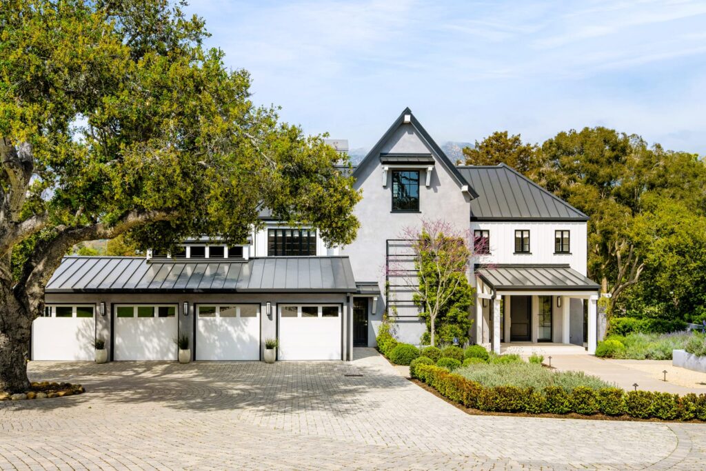 Grey and white house with a driveway